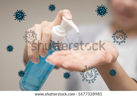 Woman Hand Pump Alcohol Gel to Clean Her Habnd in order to Kill Germs and Corona Virus Royalty-Free Stock Photo #1677328981