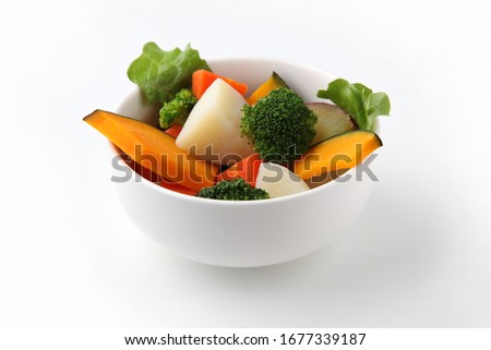 steamed vegetable salad in bowl isolated on white background