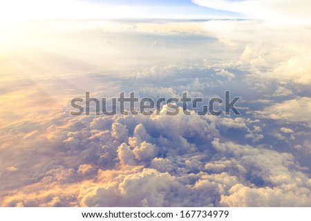 Clouds and sky as seen through window of an aircraft Royalty-Free Stock Photo #167734979