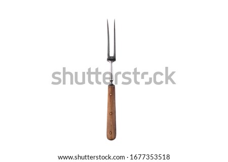 Meat fork isolated on a white background. Royalty-Free Stock Photo #1677353518