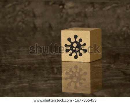 the logo of the contagion on a wooden cube