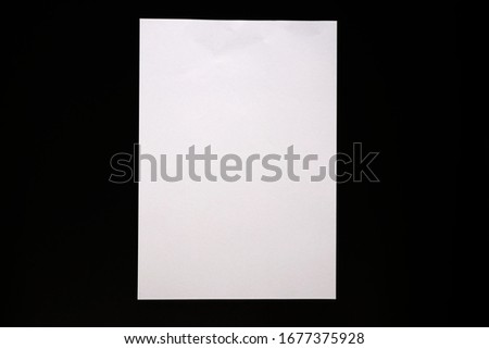 Isolated white paper and black background