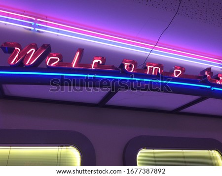 Colorful neon lights of welcome