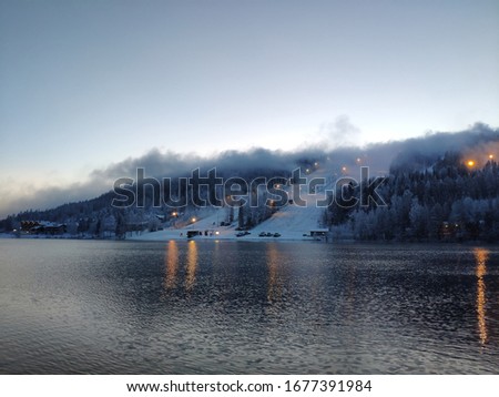 Tahko ski resort landscape photo. Lake and forest