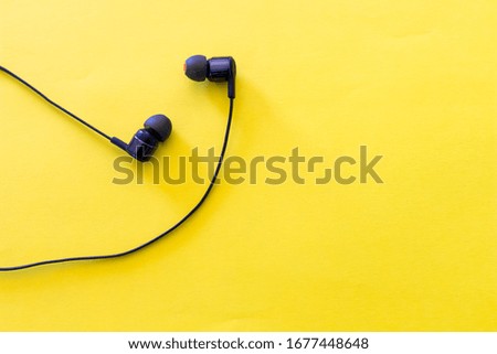 headphones for listening  music in relax moment lay on color background. background for relax and free days with music. smart activities and music streaming services