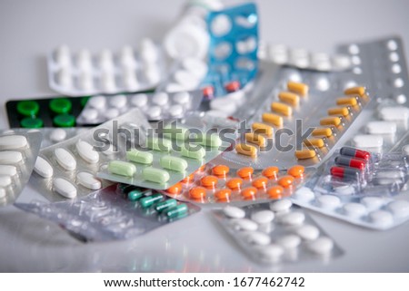Pills on the table, colourful pills, medication.  Royalty-Free Stock Photo #1677462742
