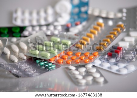 Pills on the table, medicine, colourful pills Royalty-Free Stock Photo #1677463138