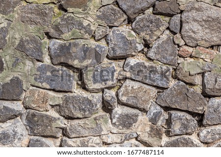 Rough stone wall with rough texture