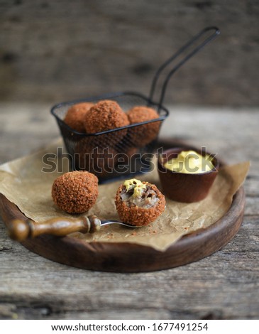 Bitterballen with mustard, warm fried snack, served in the Netherlands Royalty-Free Stock Photo #1677491254