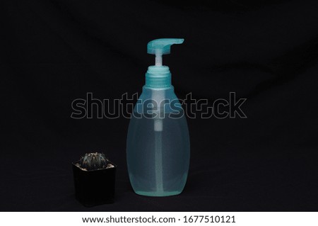 Alcohol gel in bottles for hand washing helps protect from Covidir 2019. Black background ... Health care concept