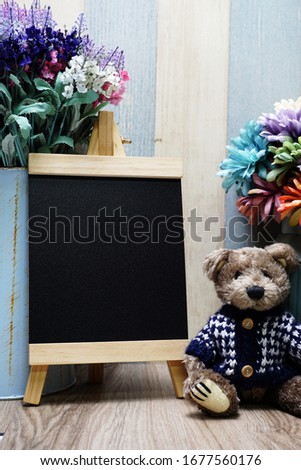 Space wooden easel black with space copy on wooden background