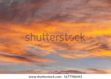 Beautiful stormy sunset sky. Abstract of Storm cloudy is coming during Sunset over the sky.