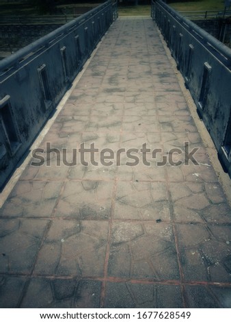 Vintage picture of Retro bridge footpath surface.