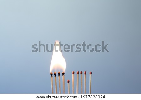 Matchsticks burn, one piece prevents the fire from spreading - the concept of how to stop the coronavirus from spreading: stay at home as #stayathome Royalty-Free Stock Photo #1677628924
