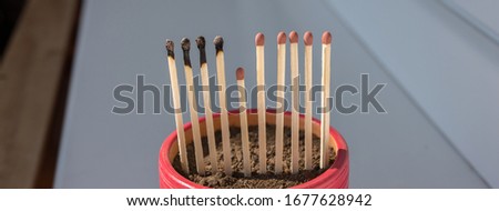 Matchsticks burn, one piece prevents the fire from spreading - the concept of how to stop the coronavirus from spreading: stay at home as #stayathome Royalty-Free Stock Photo #1677628942