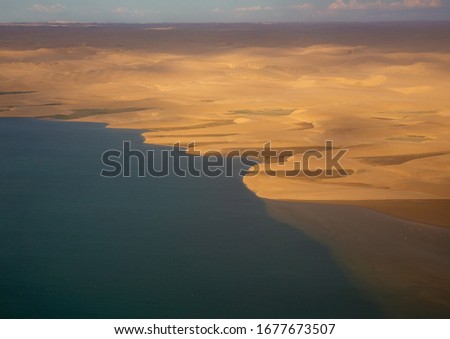 Aerial picture of the landscape of the Namib Desert and the Atlantic Ocean on the Skeleton Coast in western Namibia during summer