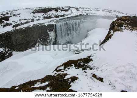 Famous waterfall in northern Iceland in the ice and snow.