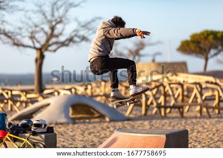 young man practicing skateboarding in a skate park