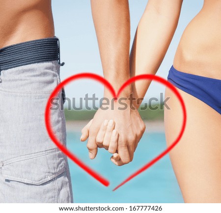 closeup picture of man and woman holding hands