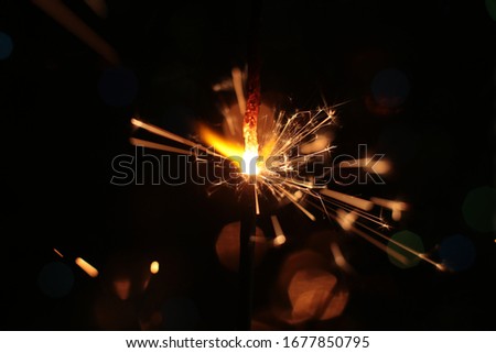festive burning sparkler macro photo