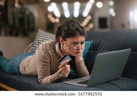 Businesswoman buying online. Beautiful woman with laptop and credit card. 