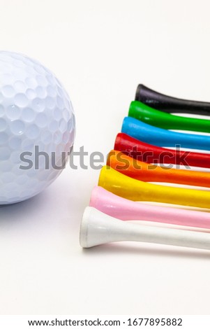Golf set - ball with tees. Golf tees in the rainbow colors.