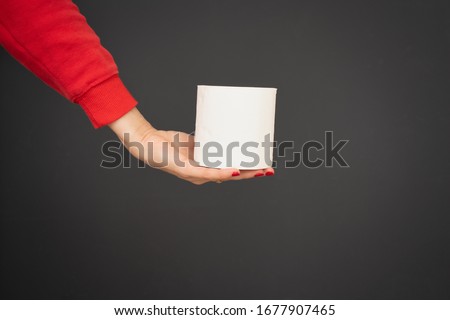 Taking toilet paper in hand dark background