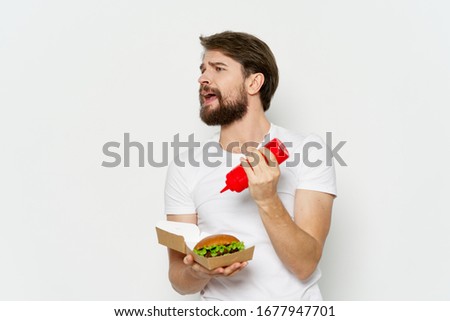 Bearded man and white t-shirt fast food diet lifestyle snack