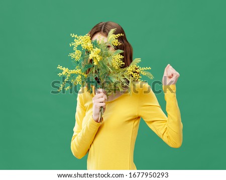 cheerful woman with bouquet of flowers holiday spring green background