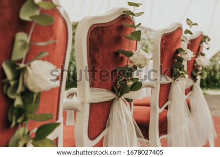 Wedding decoration on chairs while waiting on the happy couple