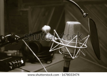 monochrome condenser microphone in recording studio