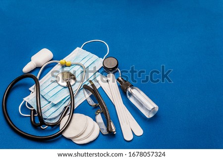 Set of diverse medical items. Means for the prevention, personal hygiene and treatment of the symptoms of coronavirus. COVID-19 pandemic, 2019-nCoV worldwide concept. Trendy blue color background