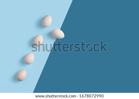 5 brown eggs on the flat background with geometric arragngment