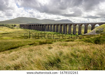Ribblehead viaduct with views of the yorkshire moors and the three peaks Royalty-Free Stock Photo #1678102261