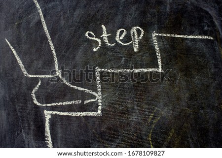 A man climbs the stairs. Chalk drawing on blackboard illustration