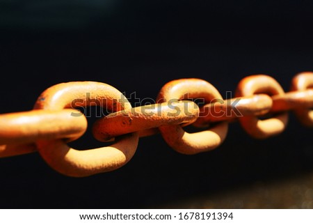 Old rusty iron chain made of black metal