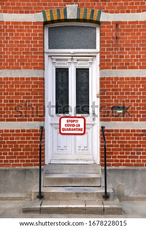 White house door with warning sign, STOP COVID-19 QUARANTINE