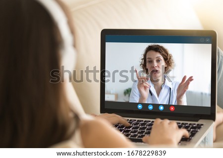 Laptop monitor view over woman shoulder, girl in headphones listens female therapist, medic gives recommendation how protect people during corona virus ncov epidemic outbreak pandemic disease concept Royalty-Free Stock Photo #1678229839
