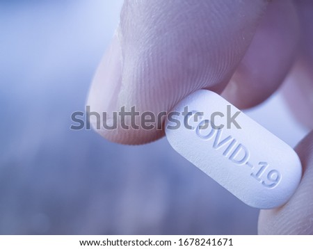 COVID 19 Coronavirus Cure drug concept in one tablet. Concept for antiviral drug for new korona virus. Medication pharmaceutical for Corona treatment. Close up concept for Covid Cure  Royalty-Free Stock Photo #1678241671