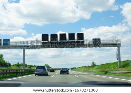 Driving on a highway, picture made from the car, view to the traffic ahead outside