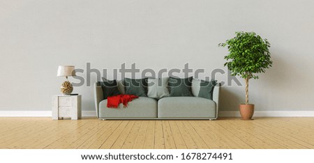 Sofa in a living room on a gray wall with copy space on the wall for picture canvas