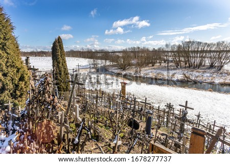 The Hill of Crosses (Kryziu kalnas) in spring after snow storm . A famous site of pilgrimage in northern Lithuania.