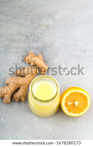 Health and diet content. Natural immune system support kit-ginger and lemon drink. Light gray background, vertical format