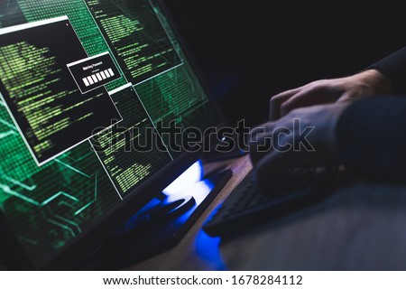 Close-up of Caucasian man hands typing data on a keyboard,seen on a computer monitor Royalty-Free Stock Photo #1678284112