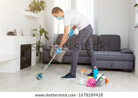 Cleaning and Disinfection at town complex amid the coronavirus epidemic. Professional teams for disinfection efforts. Infection prevention and control of epidemic. Protective gloves and mask Royalty-Free Stock Photo #1678289428