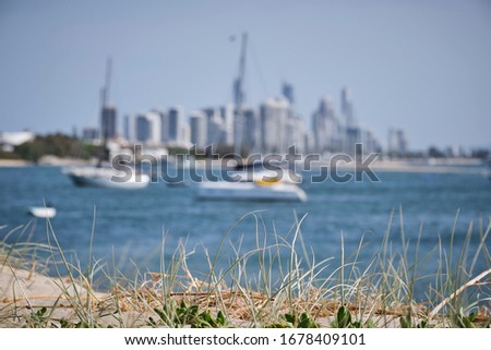 Boats on the Broadwater and bold coast skyline buildings showing off the Gold Coast, Australia lifestyle