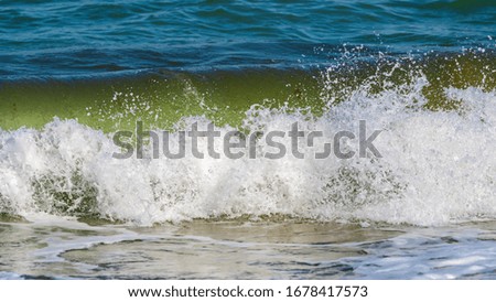 Splashing big waves on the beach