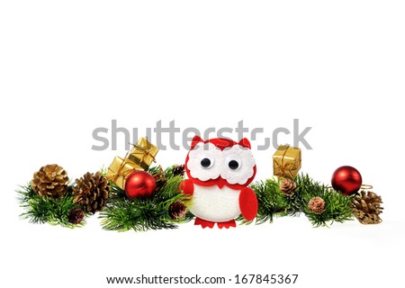 handmade, christmas owl made of felt on the background of Christmas decorations