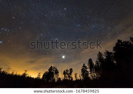 View of the starry sky and the Venus over Gersfeld in Hesse, Germany 
