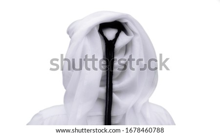 Portrait of an unknown Qatari man from behind in a traditional uniform isolated on white background Royalty-Free Stock Photo #1678460788